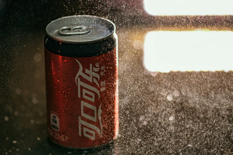 a can of soda on the floor outside of an airplane window