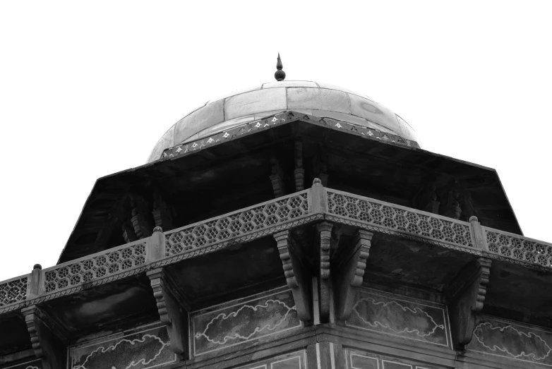 an ornate roof is shown against the sky