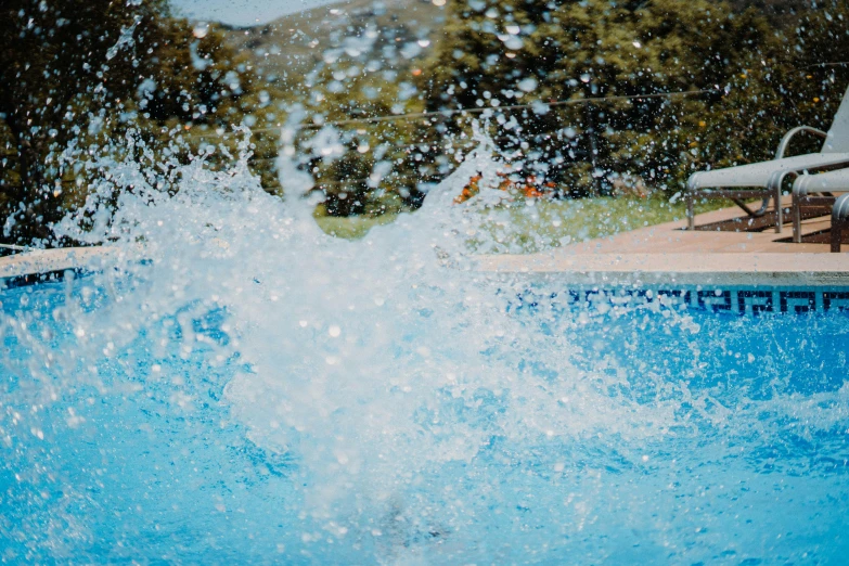 water splashing from an empty swimming pool