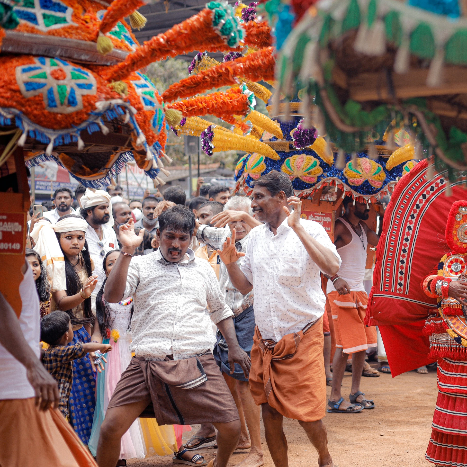 a crowd gathers around a man wearing colorful costume