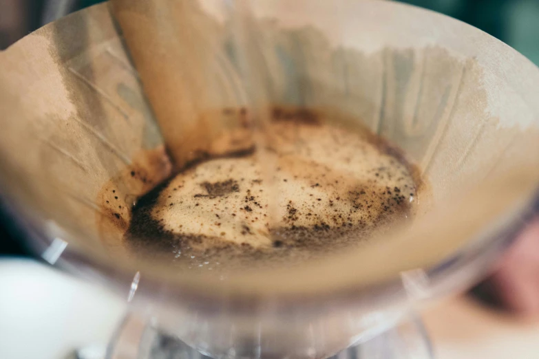 a dirty blender with coffee being mixed