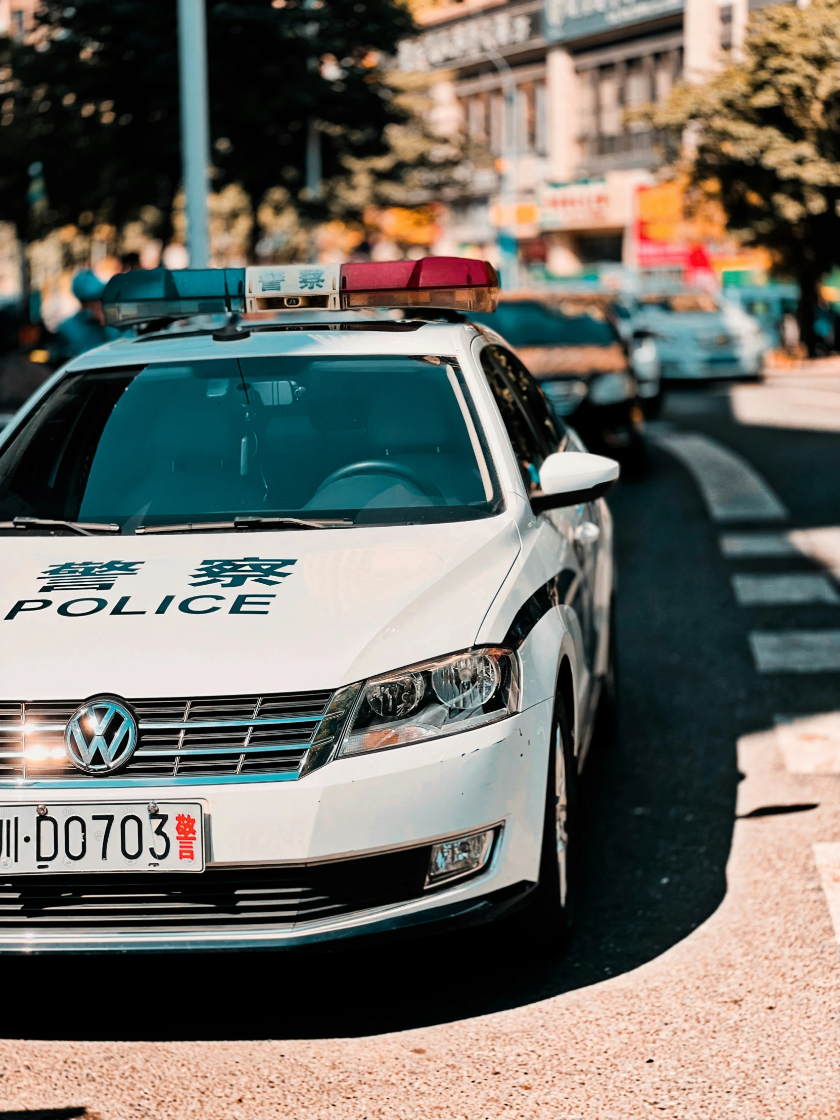 a white car parked next to the street