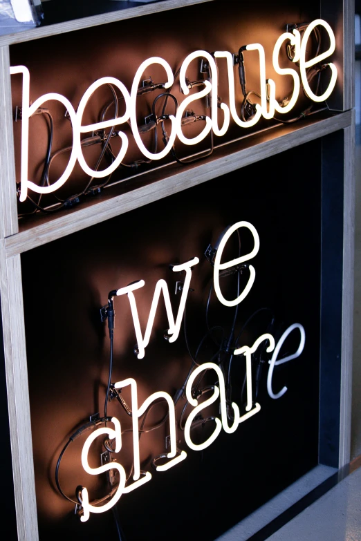 neon lights are attached to the side of a store sign