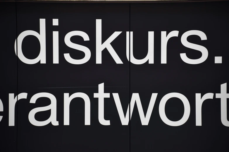 a black sign with white letters that say djs kruss gerantworthy