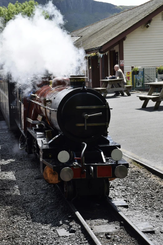 an old fashioned train that is on the railroad track