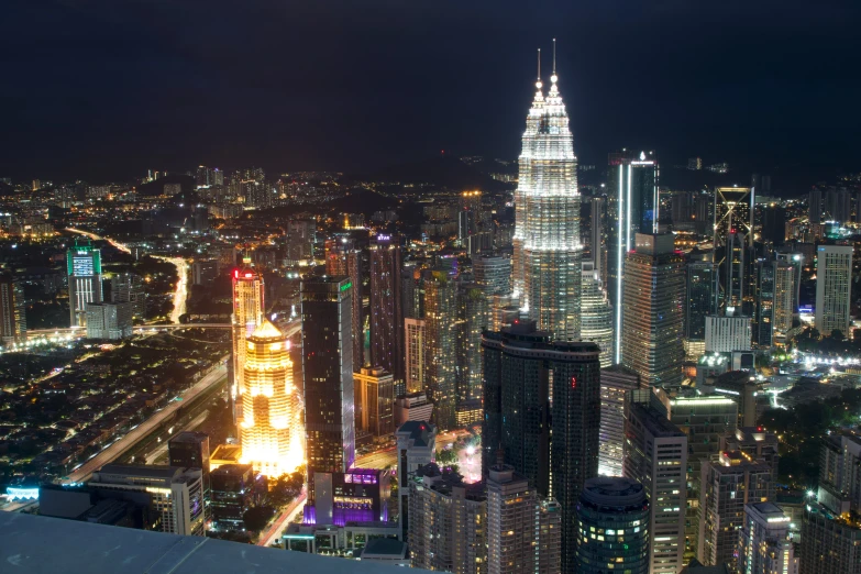 a night view of the city with skyscrs lit up