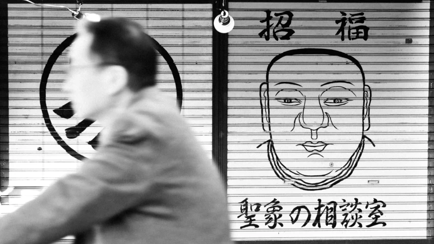 a man in front of a sign in a subway station