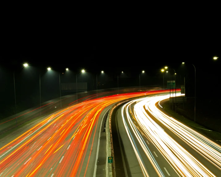 traffic in the night on the highway with bright lights