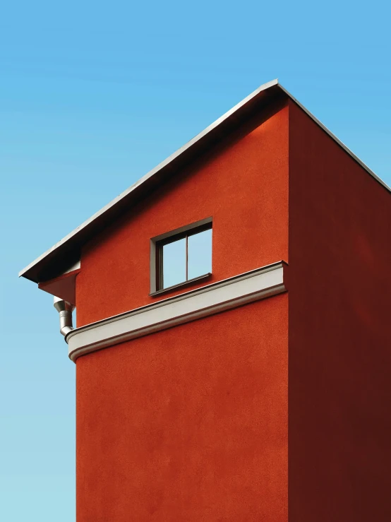 there is a red building with a window