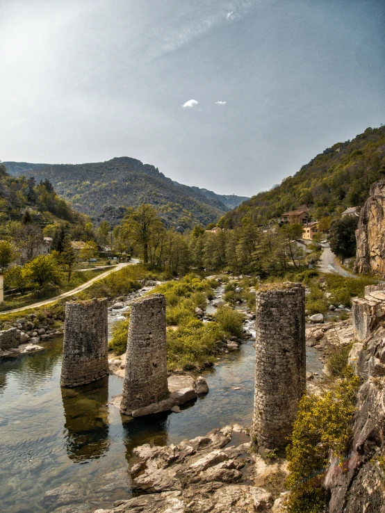 this is an image of an old bridge in the mountains