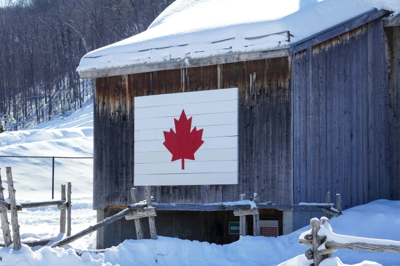 a building with a sign and a flag on the door