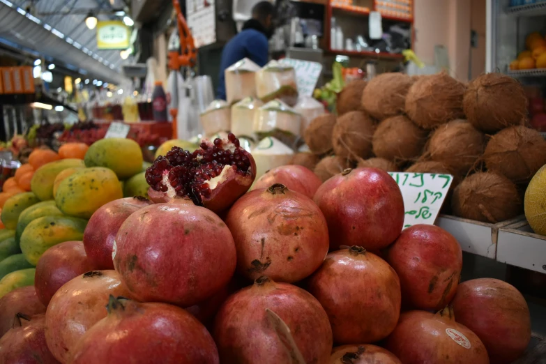 a variety of fruit for sale with a price sign on display