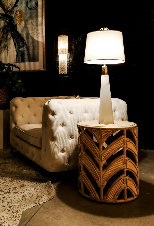 a white sofa sitting next to a white table