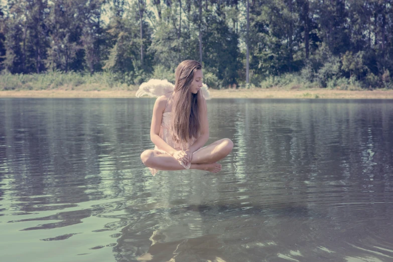 a woman that is floating down in the water