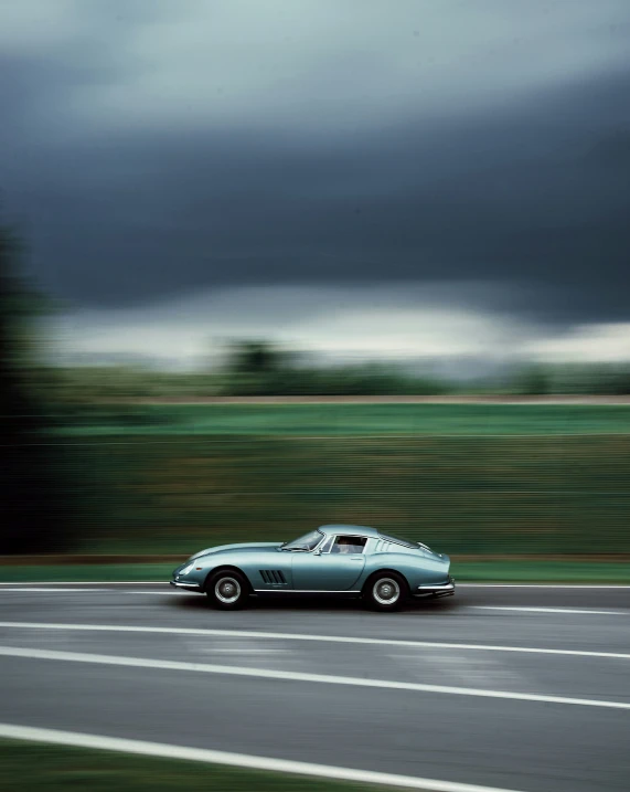 a car driving down a wet road