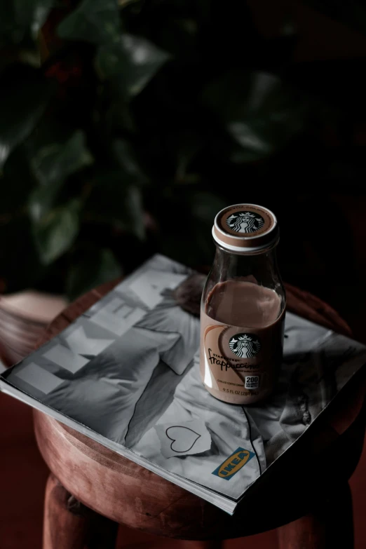 a beverage sitting on top of a wooden stool