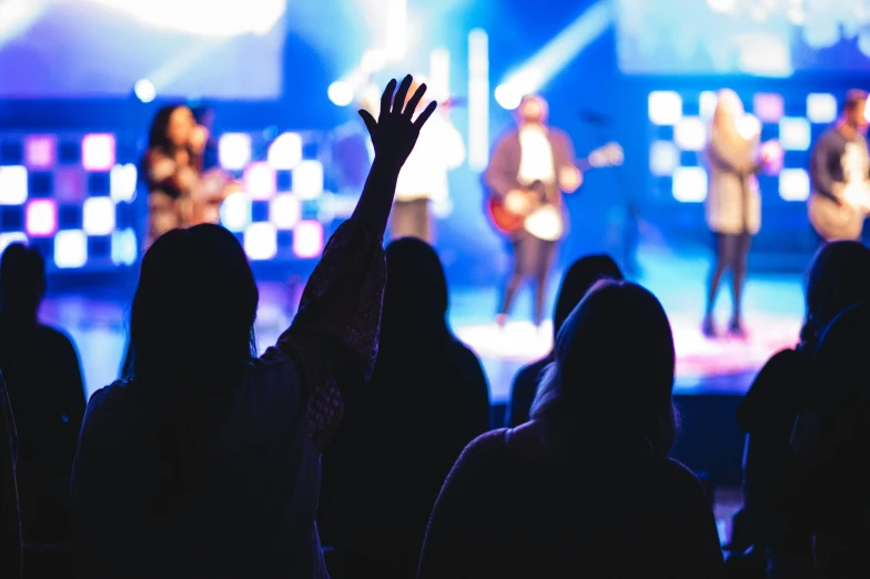 a group of people standing on top of a stage