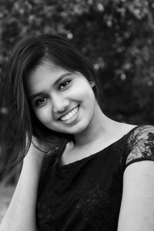 a girl is posing in black and white for a po