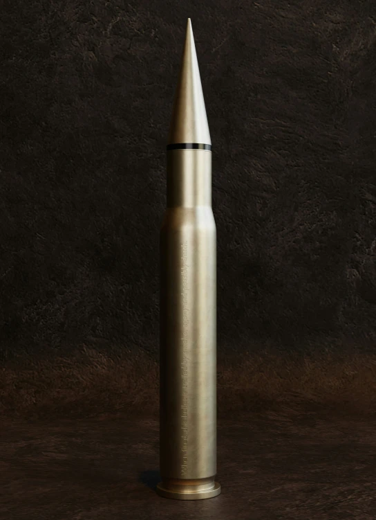 a silver metal bullet on a wooden table