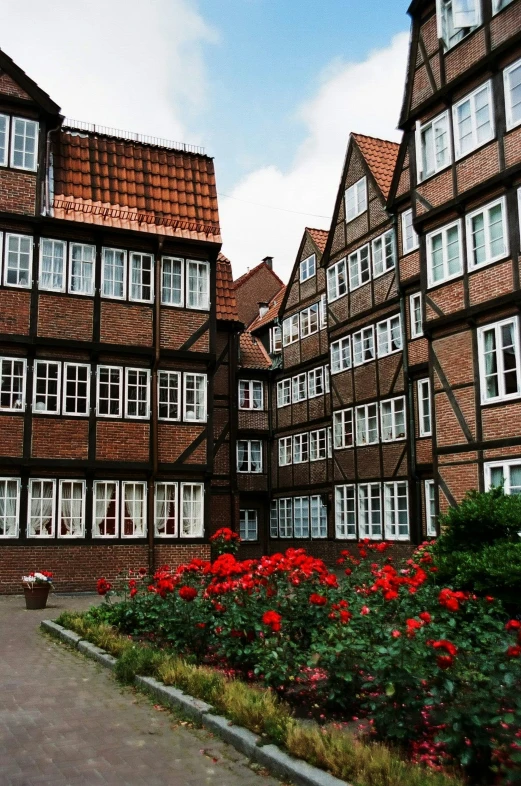 a few rows of brown buildings that are facing each other