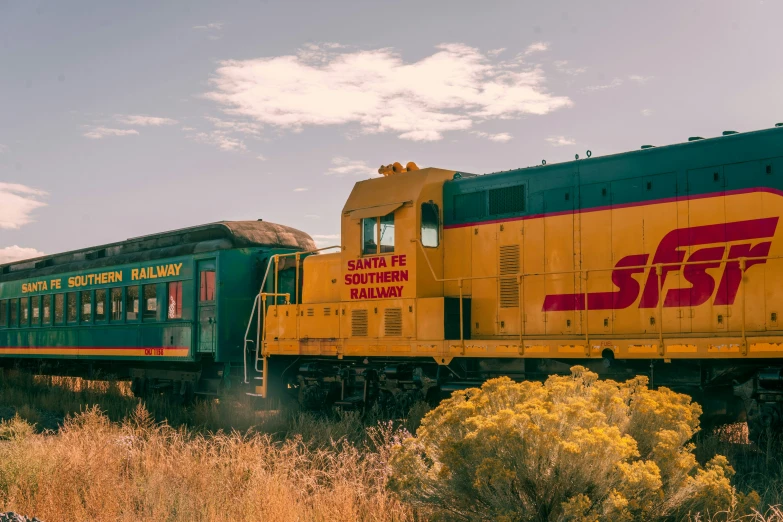 train engine pulling train cars on a track