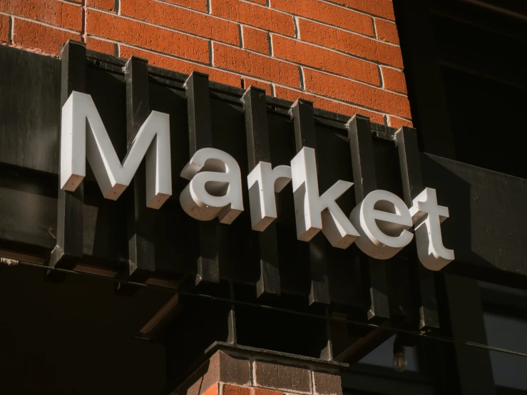 the name of a market on a brick wall