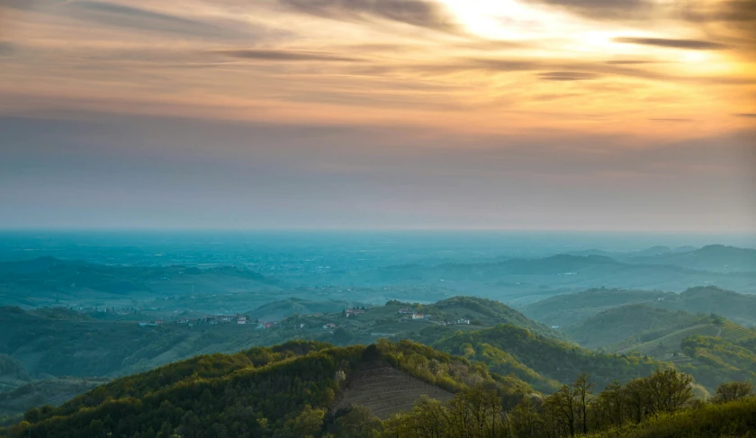 view from the top of a mountain at sunset