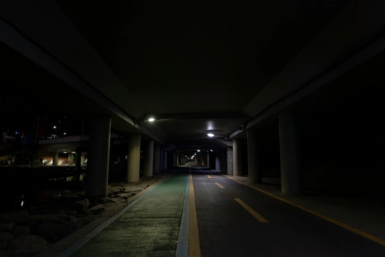 an empty alley with light at the end