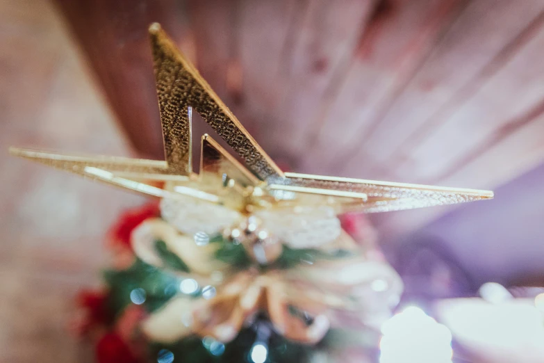 a close up image of a shoe with gold foil on it