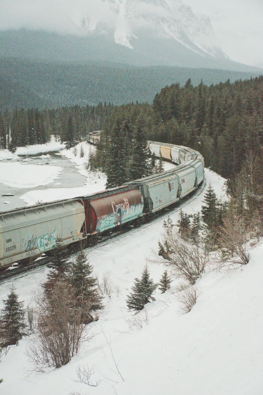 an old train is on a snowy track