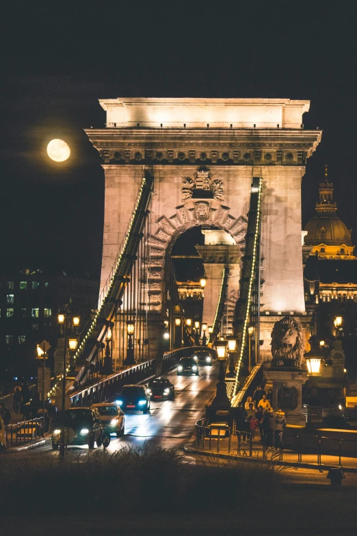 a bridge that has cars going under it at night