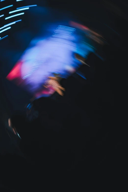 a blurry pograph of a person riding a skateboard