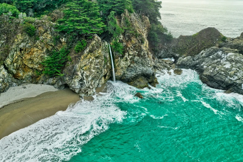 a view from above of a beach and some trees