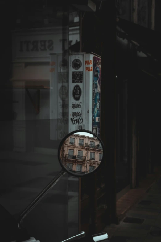 a large mirror hanging from a wall of a building