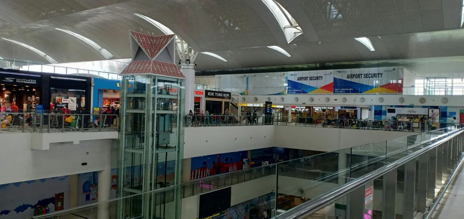the inside of a mall with metal and glass