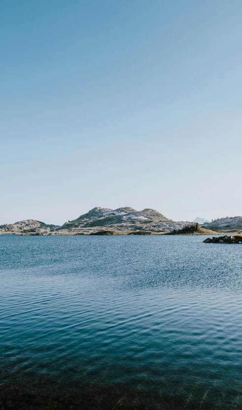 the view of several mountains and the ocean