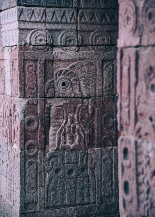 a brick wall with a decorative relief