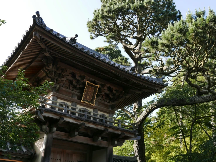 an old building with many trees around it