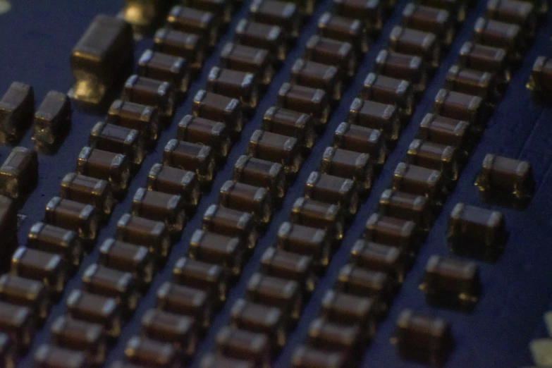 a computer keyboard that has several rows of chocolates on it