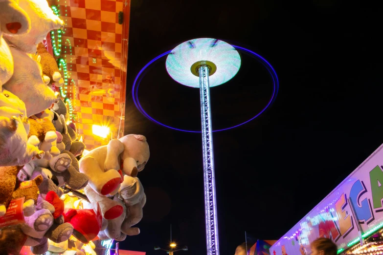 several stuff animals are on display at a carnival