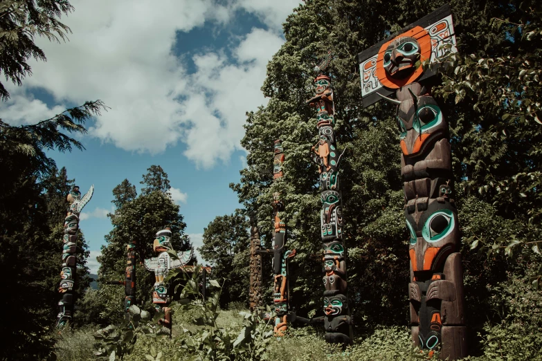 there are several totems lined up along a path