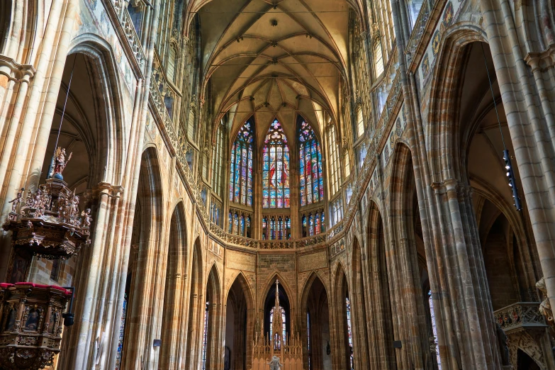 a very large cathedral with vaulted ceilings, and stained glass