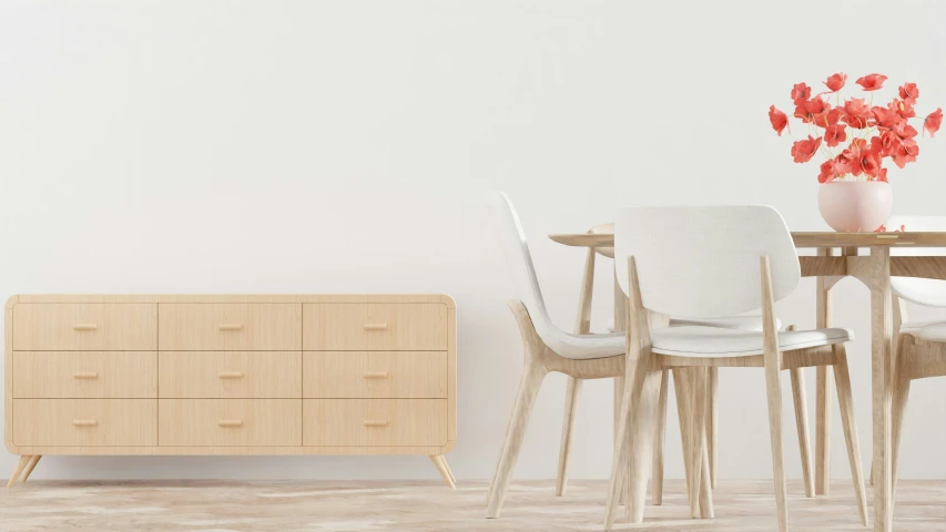 a white wall sitting next to a wooden table with chairs