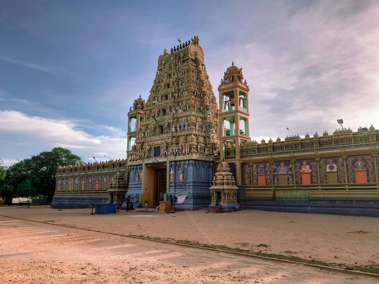 an ornate building with multiple towers on each side of it