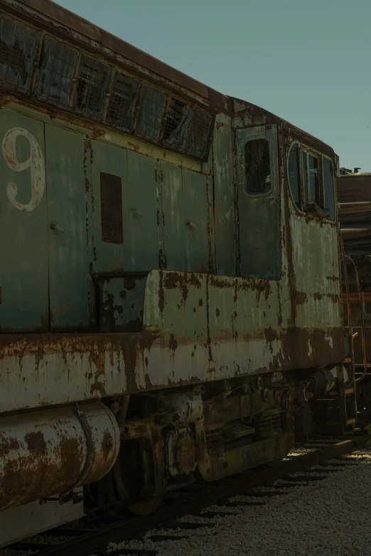 rusty rusted and worn train cars at a train station