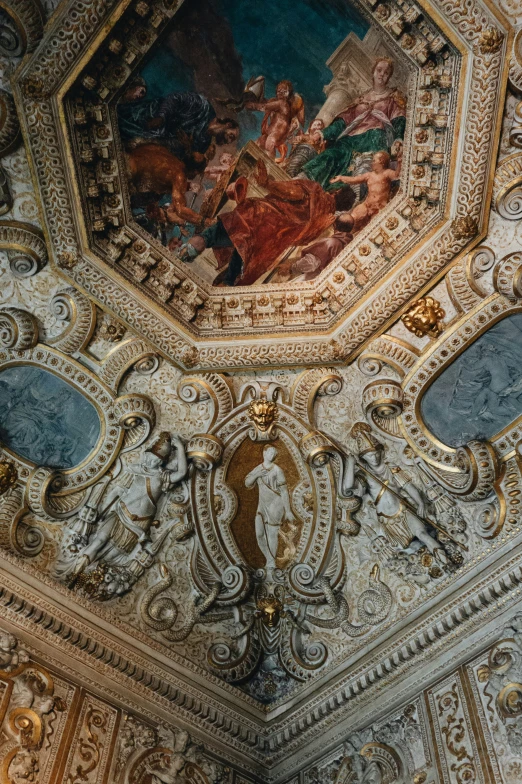 a ceiling in a church with colorful paintings