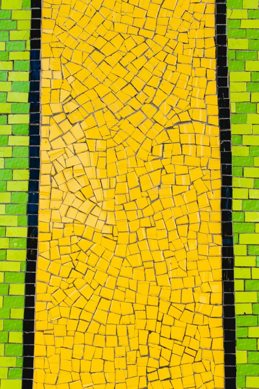 an abstract painted yellow, green and black tile design