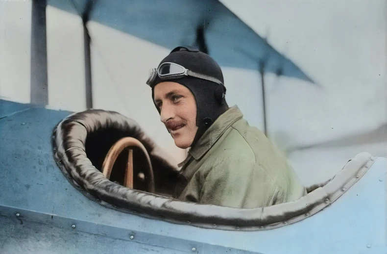 a man in a air plane with goggles