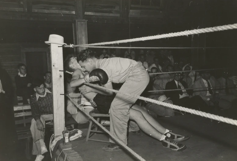 the boxing scene shows two men fighting on one side