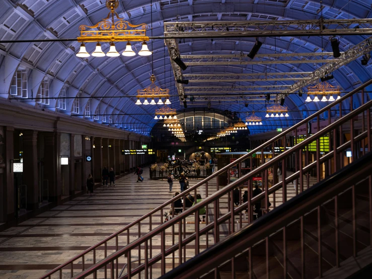 an empty train station in a large building